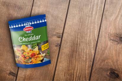 Das Bild zeigt den Schärdinger Cheddar gerieben